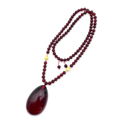Red amber pendant with lens