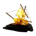 Amber souvenir on a wooden stand «Ship»