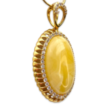 Gold-plated pendant with amber and zircons