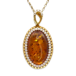 Gold-plated pendant with amber and zircons