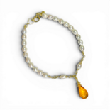 Collier avec grand ambre miel et perles