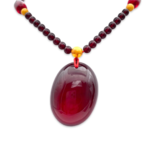 Red amber pendant with lens