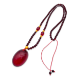 Red amber pendant with lens