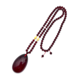 Red amber pendant with lens