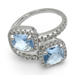 Silver ring with blue zircons