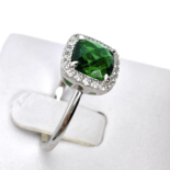 Silver ring with green zircon