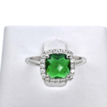 Silver ring with green zircon