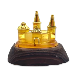 Amber souvenir on a wooden stand