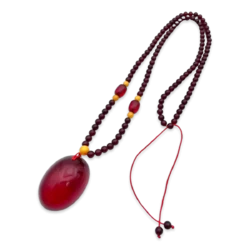 Red amber pendant with lens