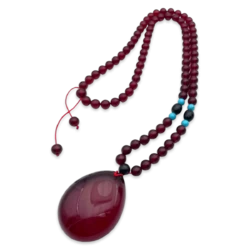 Colgante de Ámbar Rojo con Lente