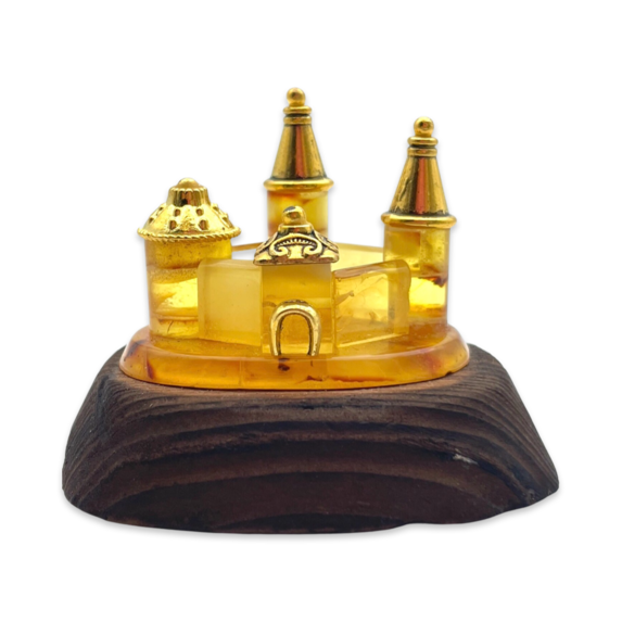 Amber souvenir on a wooden stand