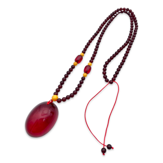 Red amber pendant with lens